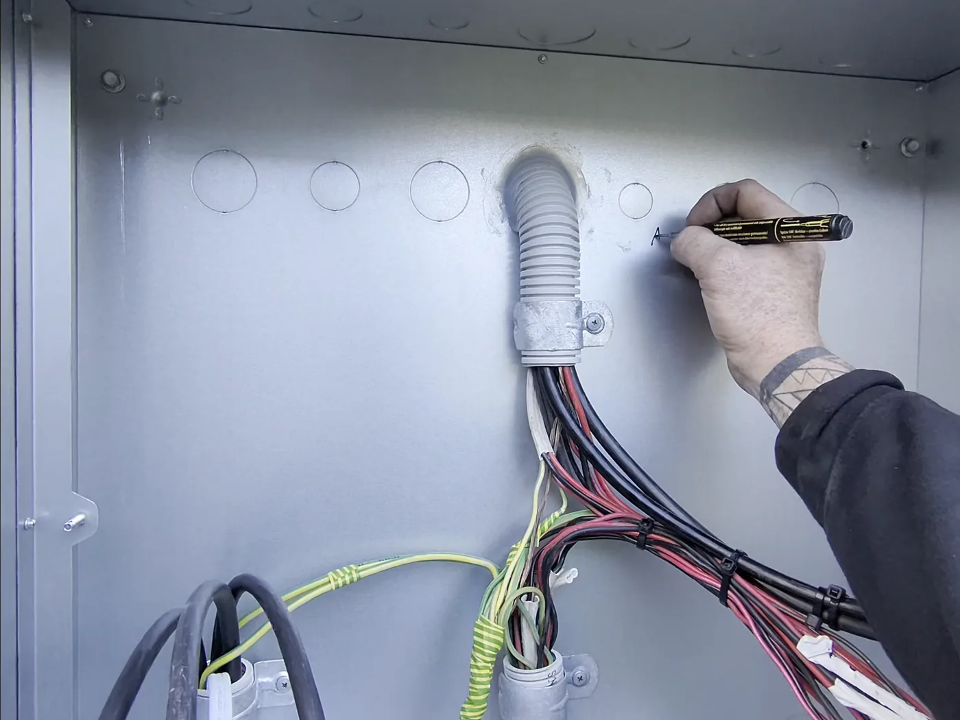 Venux electrician testing and preparing electrical supply equipment