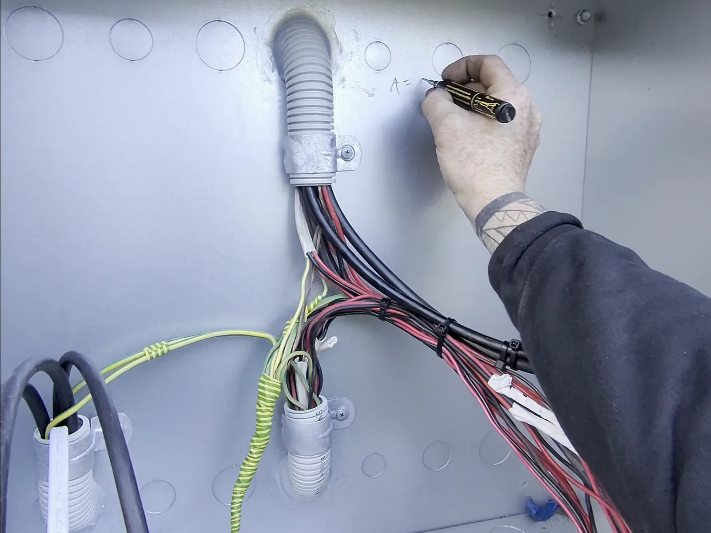 Venux electrician testing and preparing electrical supply equipment