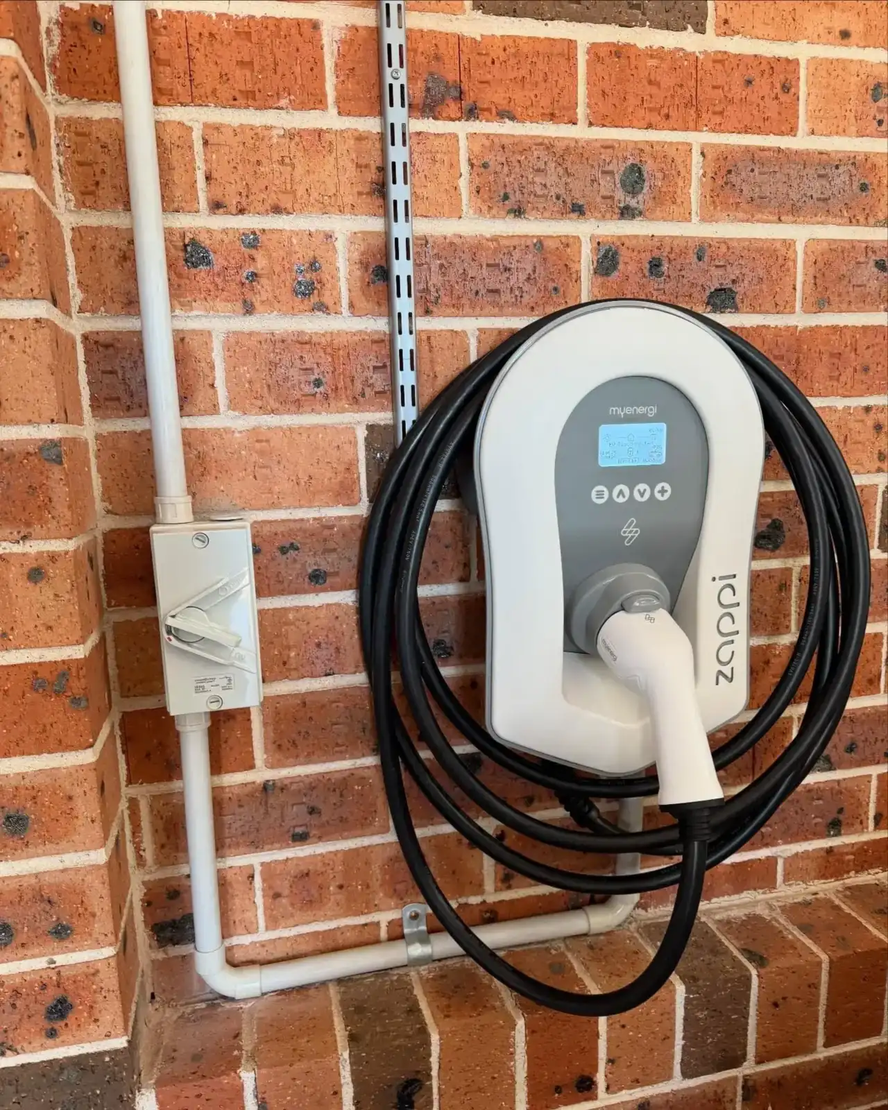 EV charger · brick home by Venux Electrical